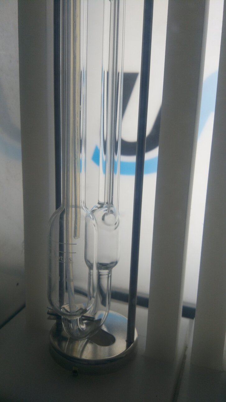 Close-up of a stainless-steel capillary used for viscosity measurement